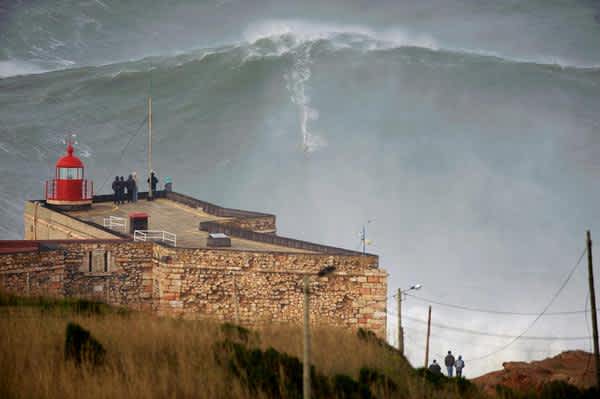 Video: World Record Holder Surfs “Biggest Wave Ever”