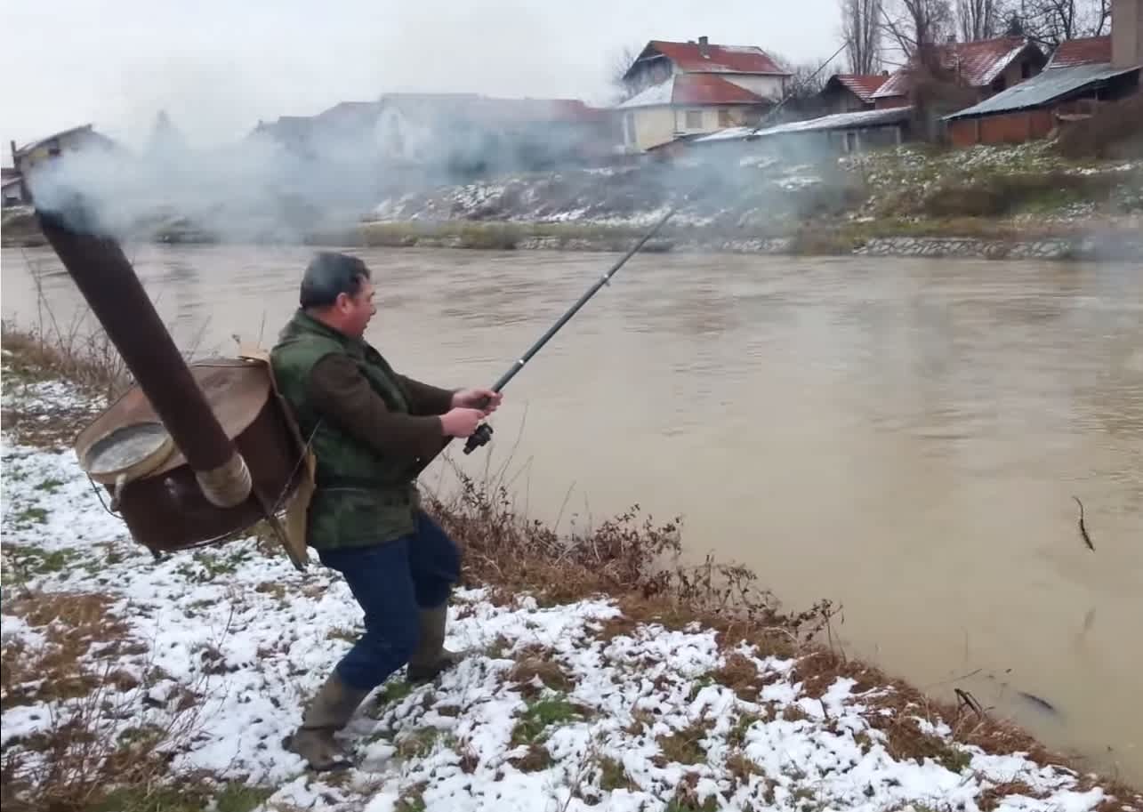 Video: Serbian Angler Straps Stove to Back to Stay Warm
