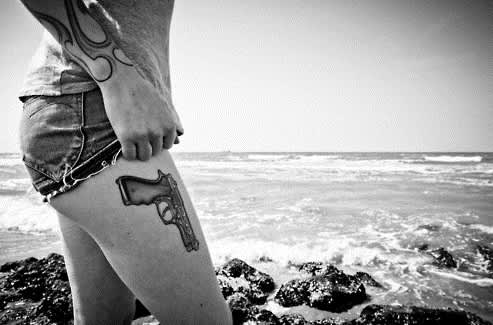 7 More Gun Tattoos That Will Leave You Slack-jawed