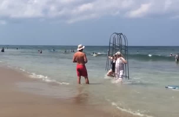 Video: Couple Denied Chance to Test Homemade Shark Cages by Lifeguard