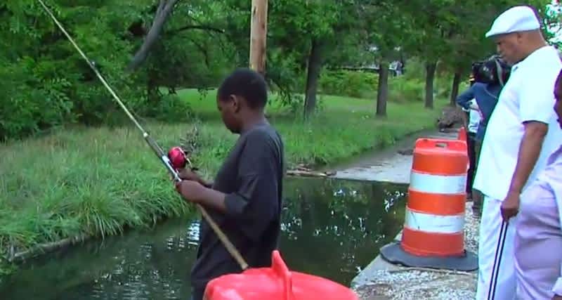 Detroit Residents Turn Giant Street Hole into Fishing Pond