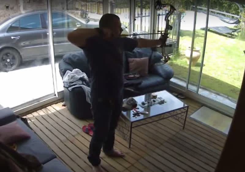Video: Man Accidentally Launches Arrow Through Glass Door