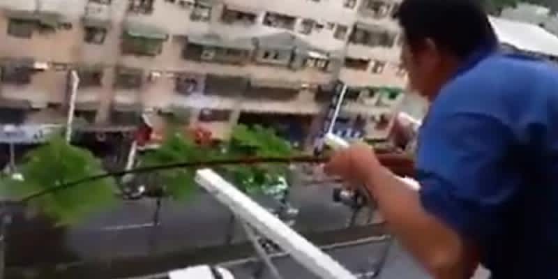 Video: Man Catches Fish from Sixth-floor Apartment Balcony