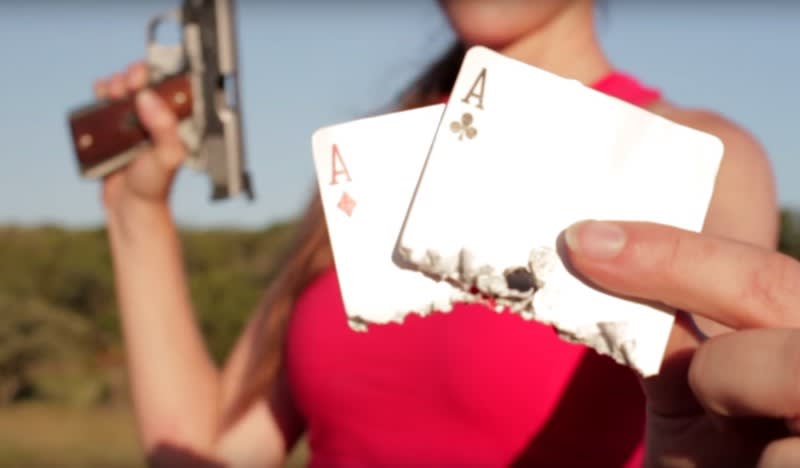 Video: Trick Shooter Splits Two Cards with Double-barreled 1911