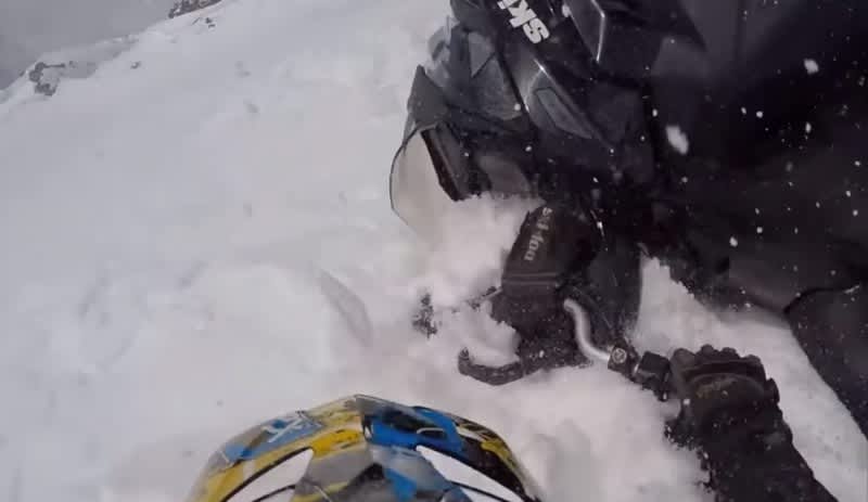 Video: Snowmobiler Swept Under by Massive Avalanche