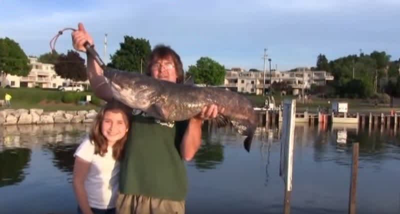 10-Year-Old Girl Catches Giant Flathead Catfish from Fishing Pier