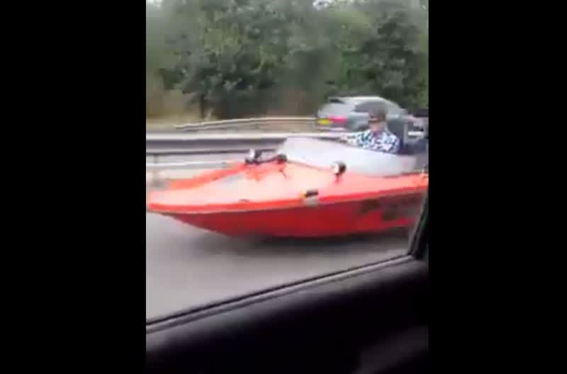 Video: Car is Passed on the Highway by a Guy Driving a Speed Boat?