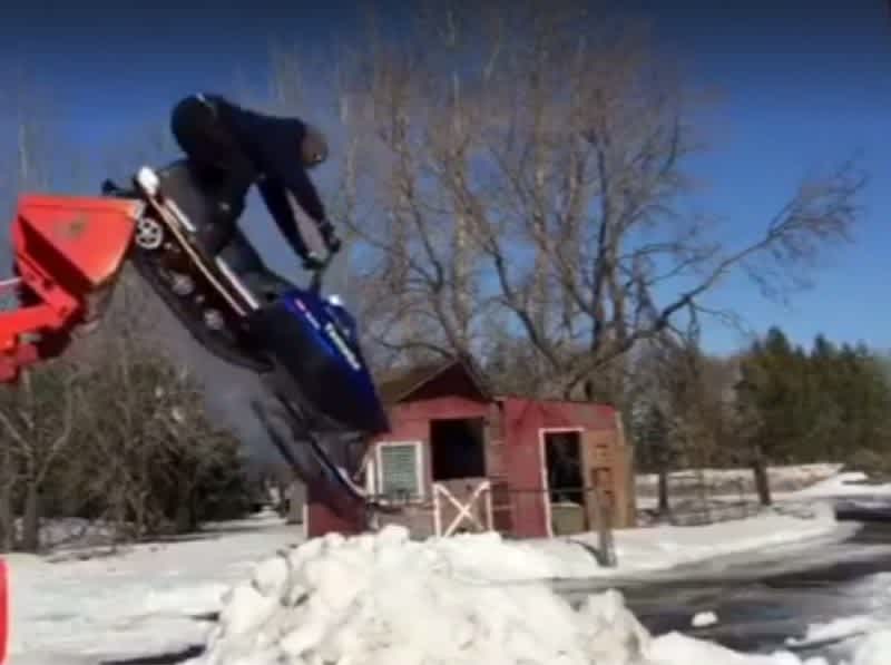 Must-See Video: Say Goodbye to Winter with This Amazing Snowmobile Trick Rider
