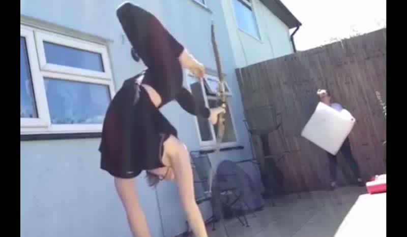 Video: Handstand Bow and Arrow Shot While Mom Holds Target Down Range