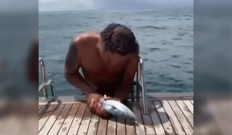 Former Tennis Player Yannick Noah Grabs Fish with Bare Hands, Bites it in Wild Video