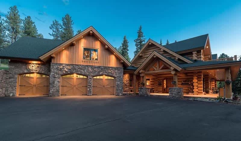 This Rocky Mountain Log Cabin Comes With a 750-Foot Zip Line & Your Own Private Trout Pond