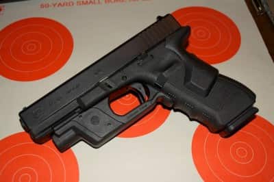 If you carry a mid-size or full size gun, you can easily add a light and laser, like this Glock 17 with Crimson Trace Lasergrip and Lightguard.