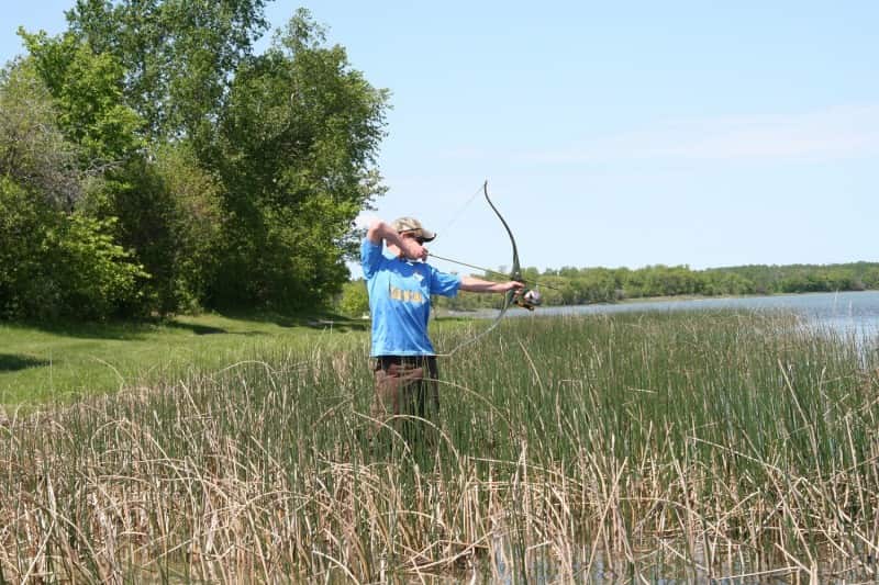 You don’t need a boat to shoot carp with a bow. A stealthy approach through shallow water will put you within range of cruising carp.