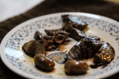 Start by cutting the rabbit meat into small pieces.