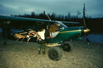Kurt Lepping's Cessna, sporting some extra weight after a successful moose harvest. Image by Dennis Dunn.