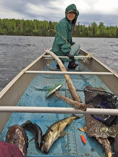 Jenny You smiles for a photo after catching a walleye in Minnesota’s Superior National Forest.