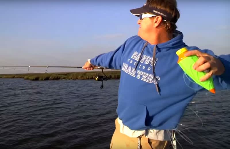 Charter Captain Charlie Thomason trying out a Fish Call. As you can see, it is thrown much like a football.