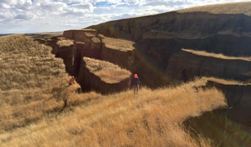 Could you imagine running into this massive crack in the earth while hunting? Don't approach it! Experts say it can be dangerous. Image from Facebook.