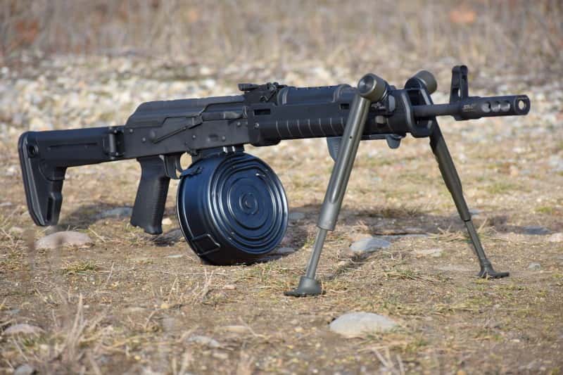 The author's custom DAKM with Zhukov furniture, a Vltor ModPod, and a 75-round drum.