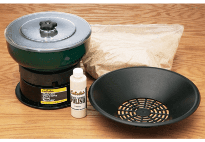 Here's an affordable vibratory brass tumbler from Cabelas.