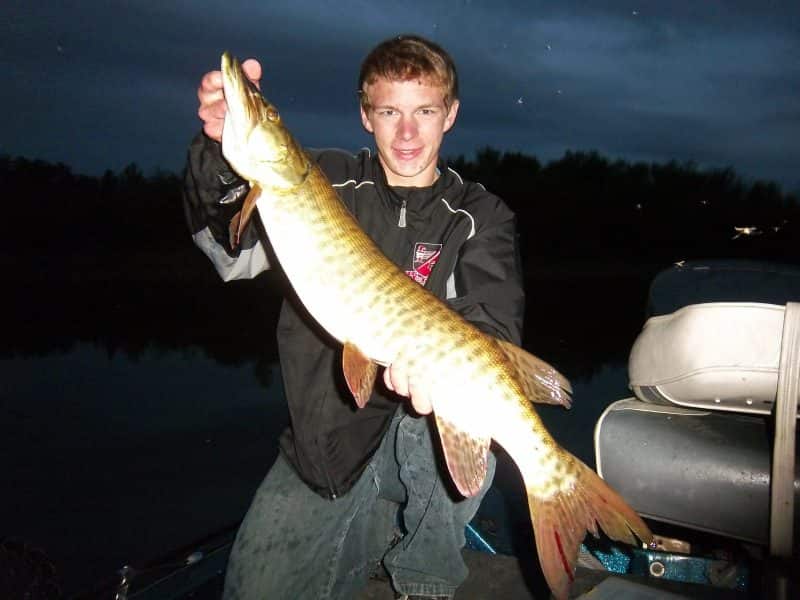 The author’s son, Dawson, with a nighttime muskie caught on a topwater.