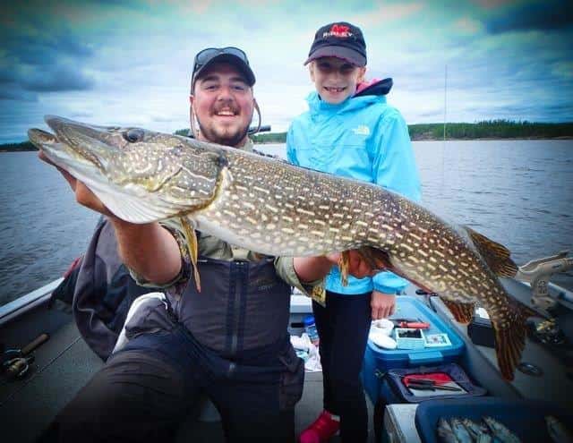 Guest Sidney Reid, age 10, with a 41-inch Master Angler pike.